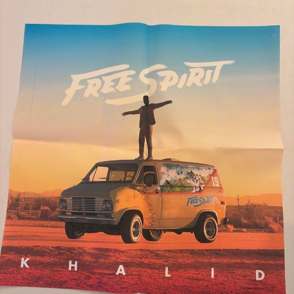 Khalid Free Spirit poster with graphic of a person standing on a van